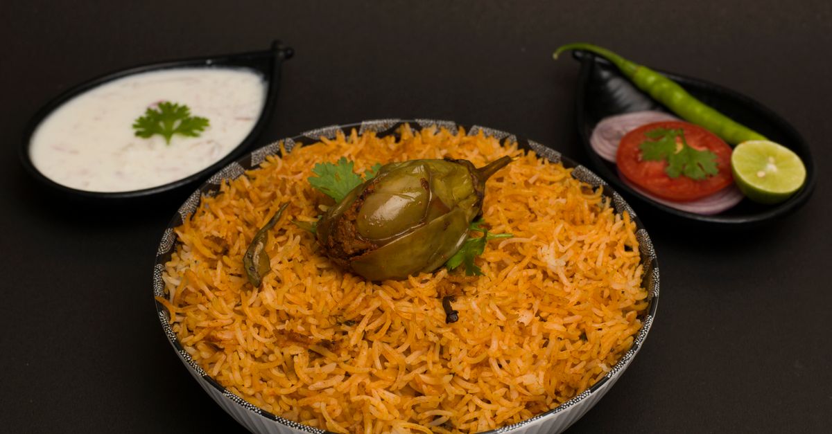 Hyderabadi biryani platter with saffron rice and fried onions